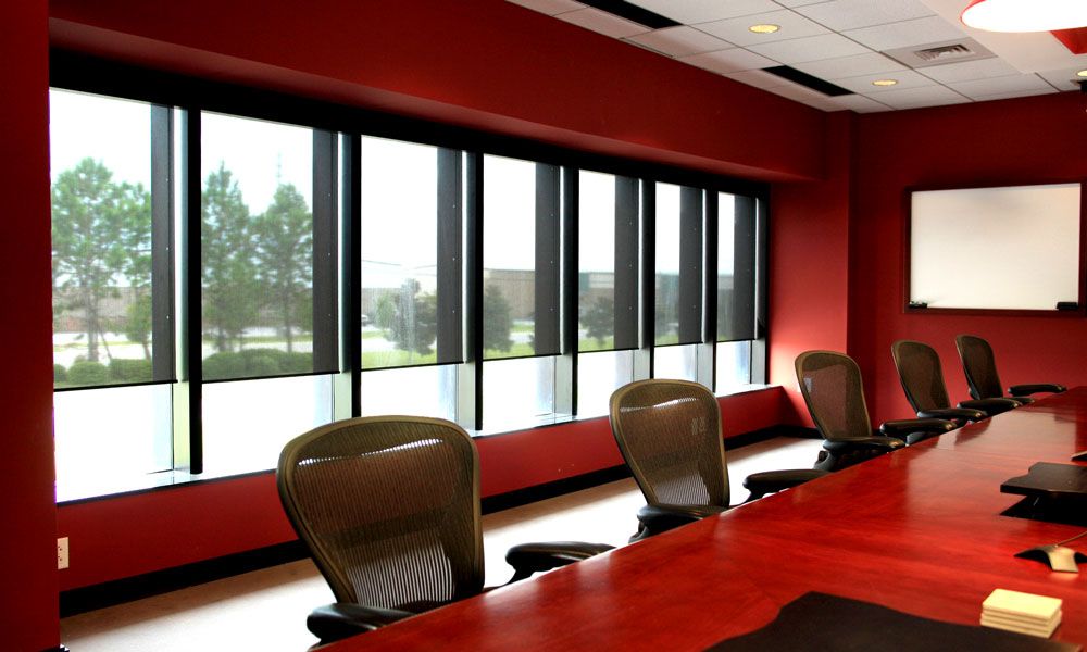 red conference room with motorized window treatments
