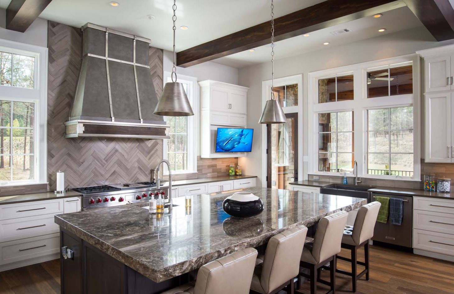 large home at dusk with trees in front of it