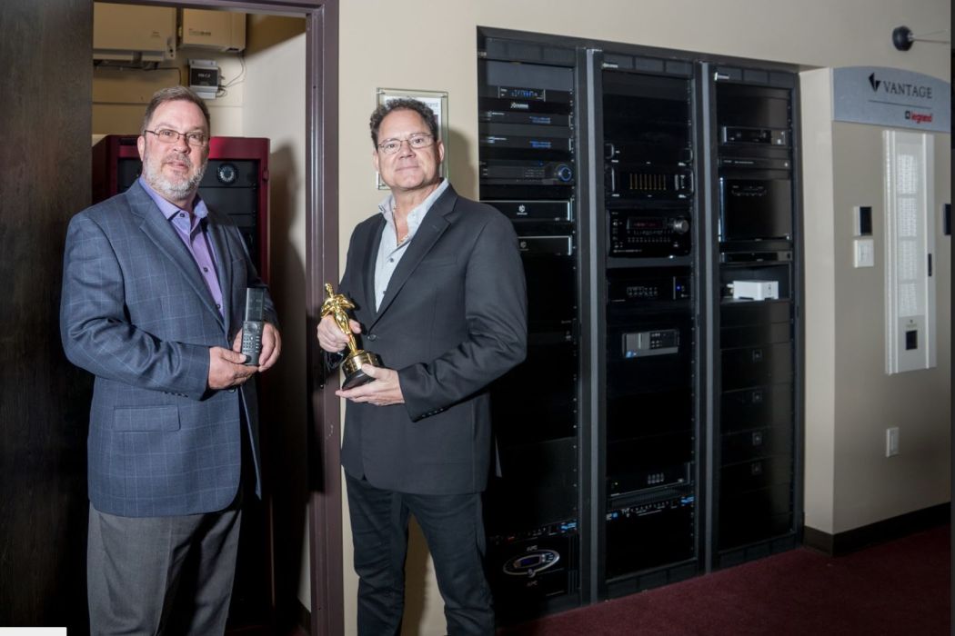 home theater with grey seating and LEDs in ceiling