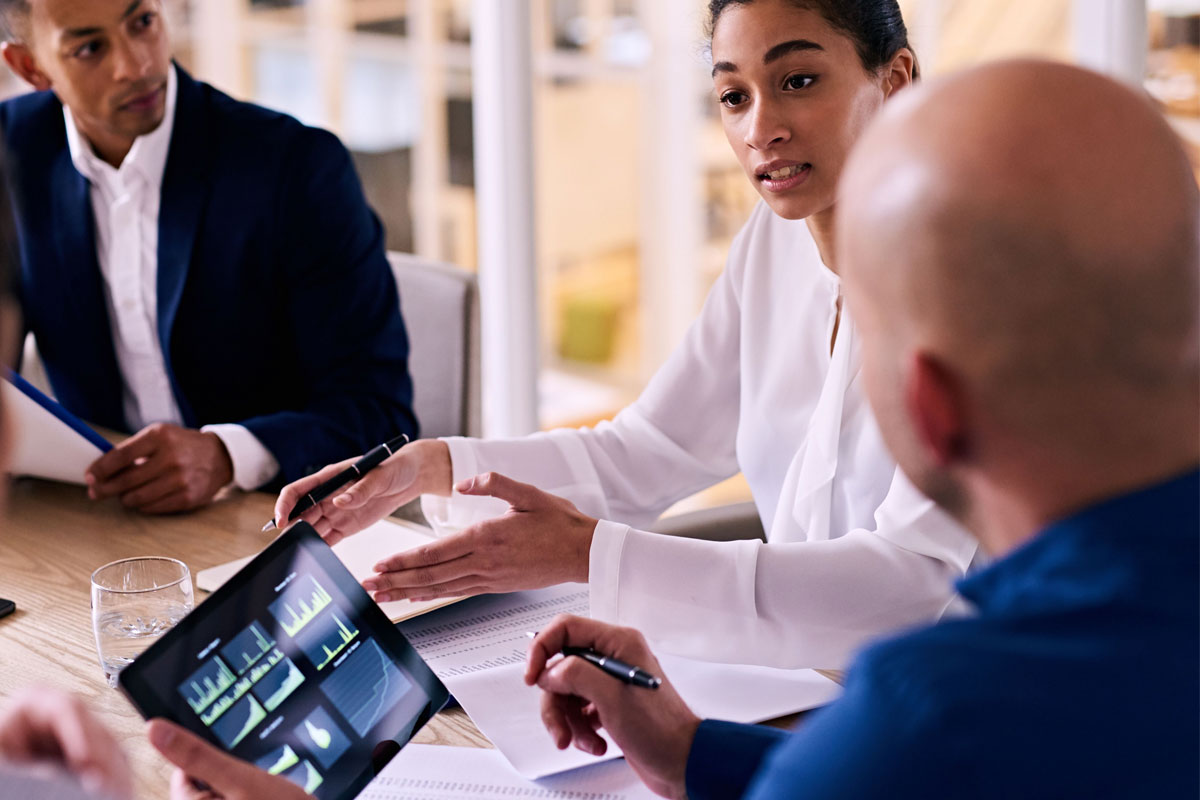 employees discussing energy readings