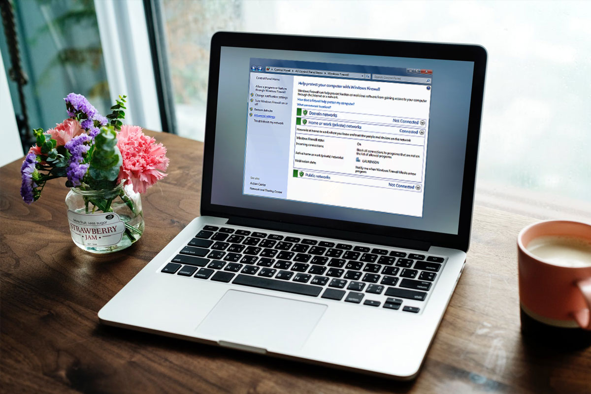 laptop on wooden desk