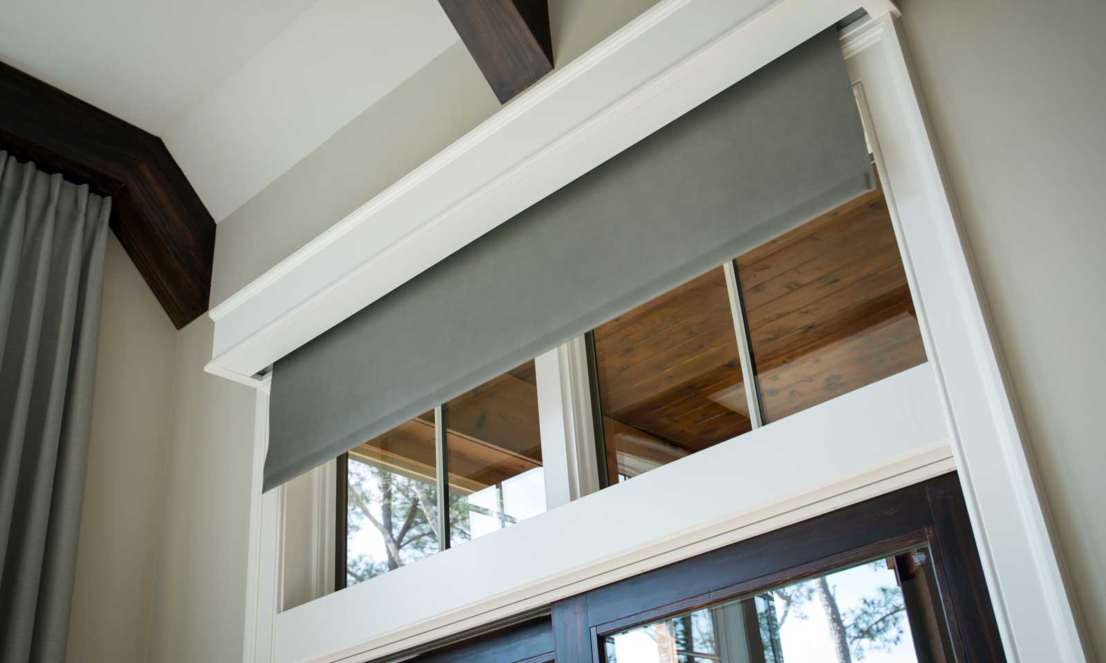 Motorized shading on window with white trim