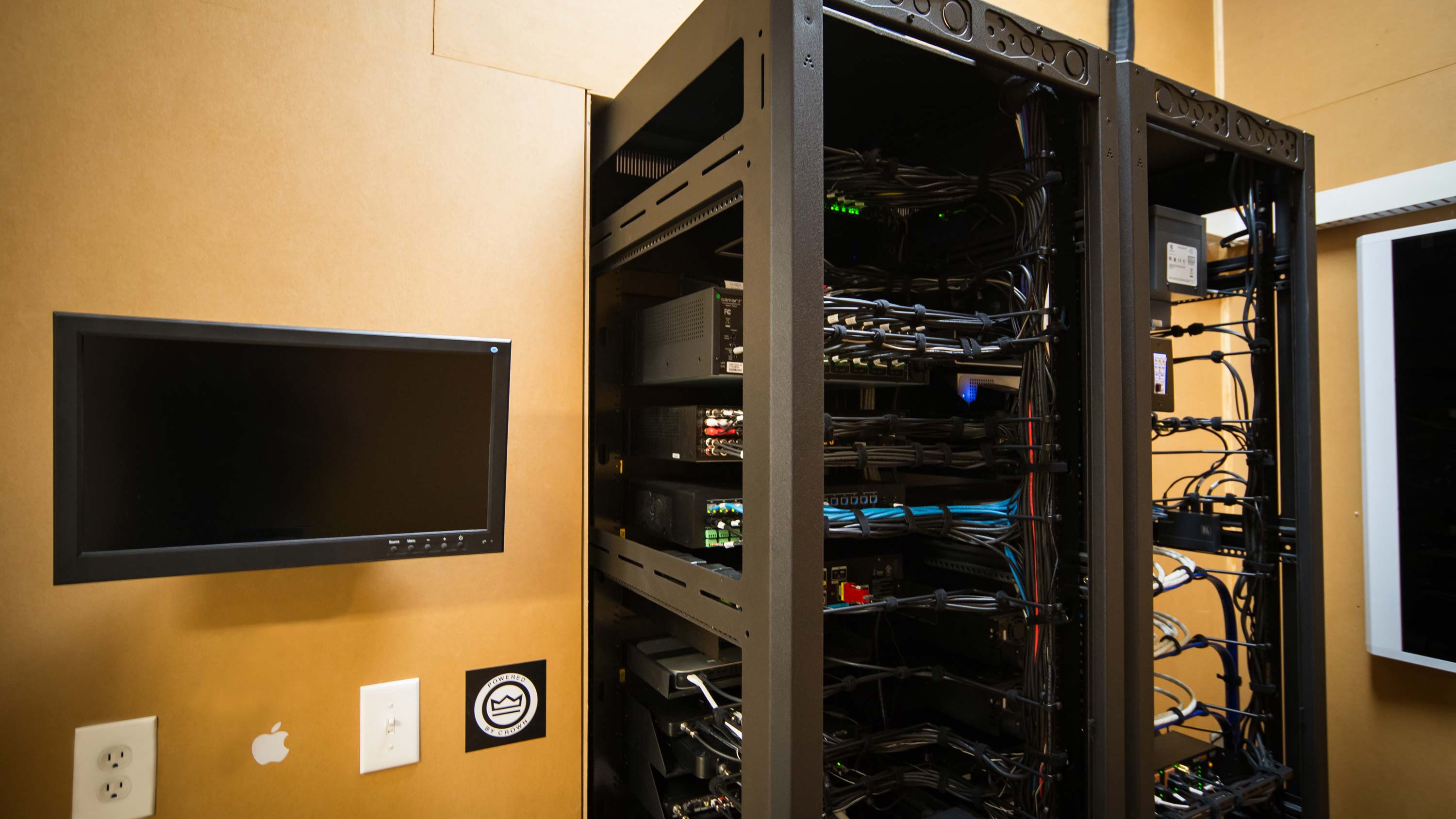 A large distribution tower next to a tv screen