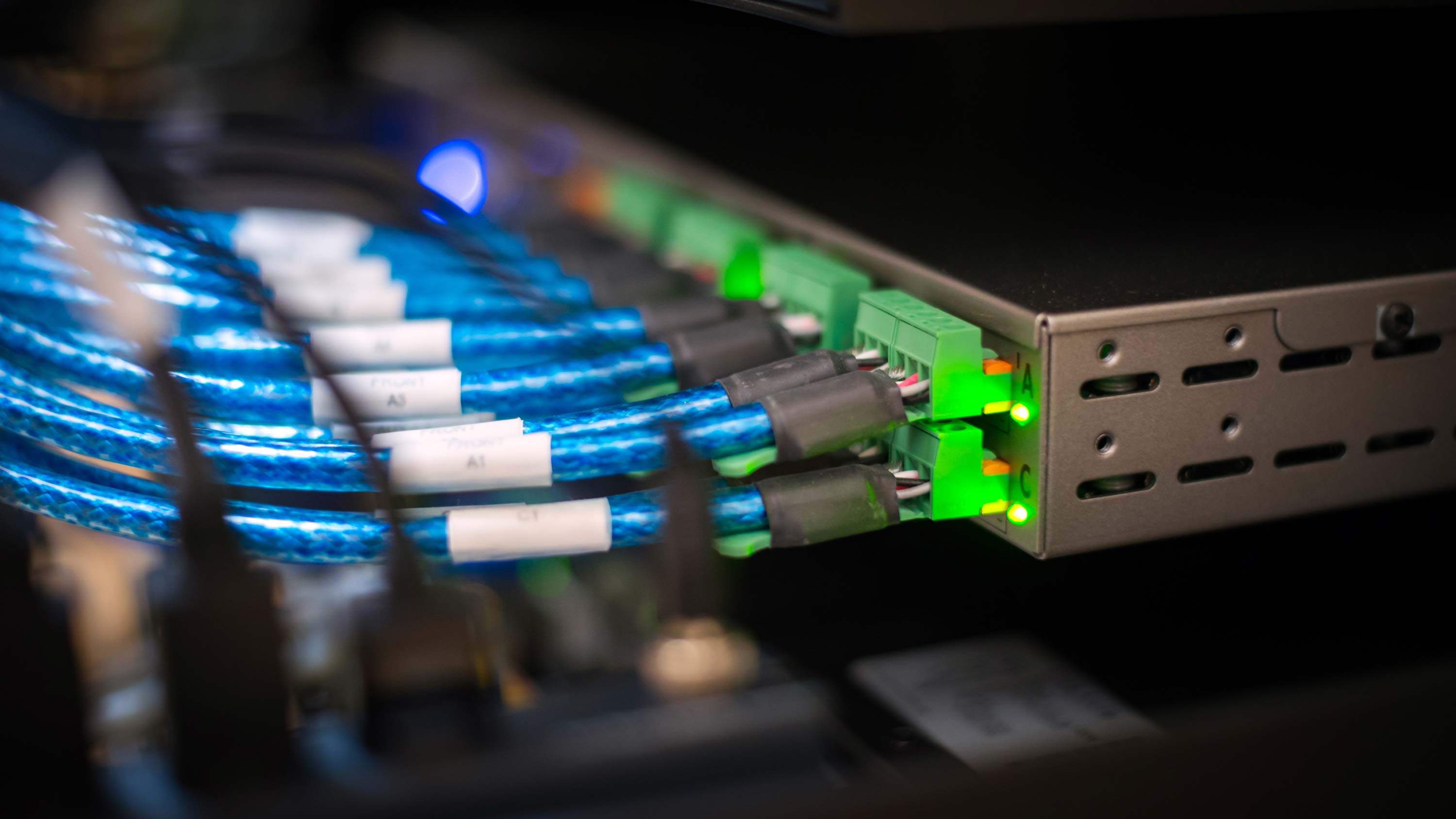 blue wires plugging into a box