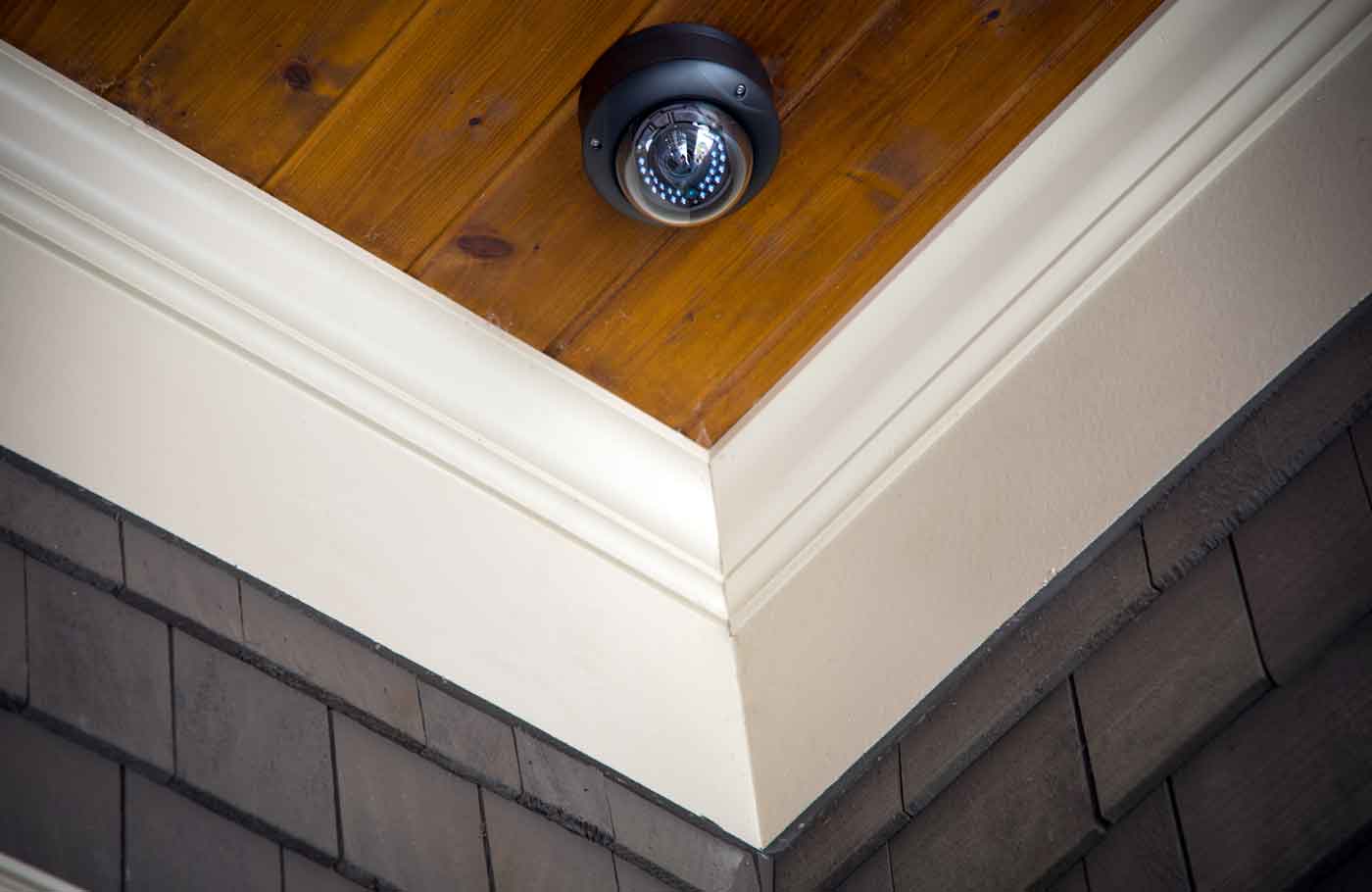 security camera on wooden ceiling