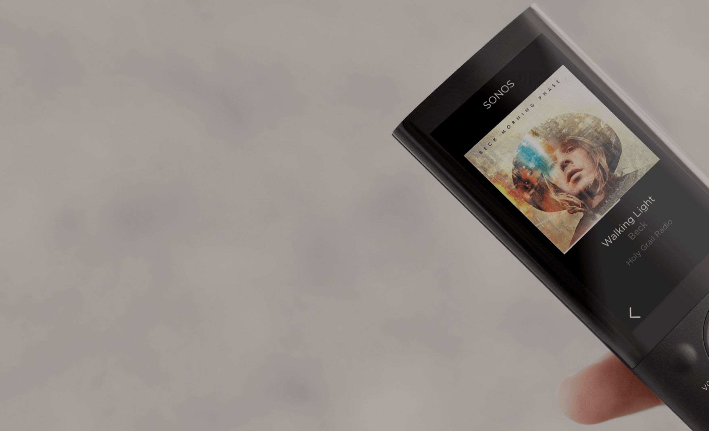 woman pointing remote at screen