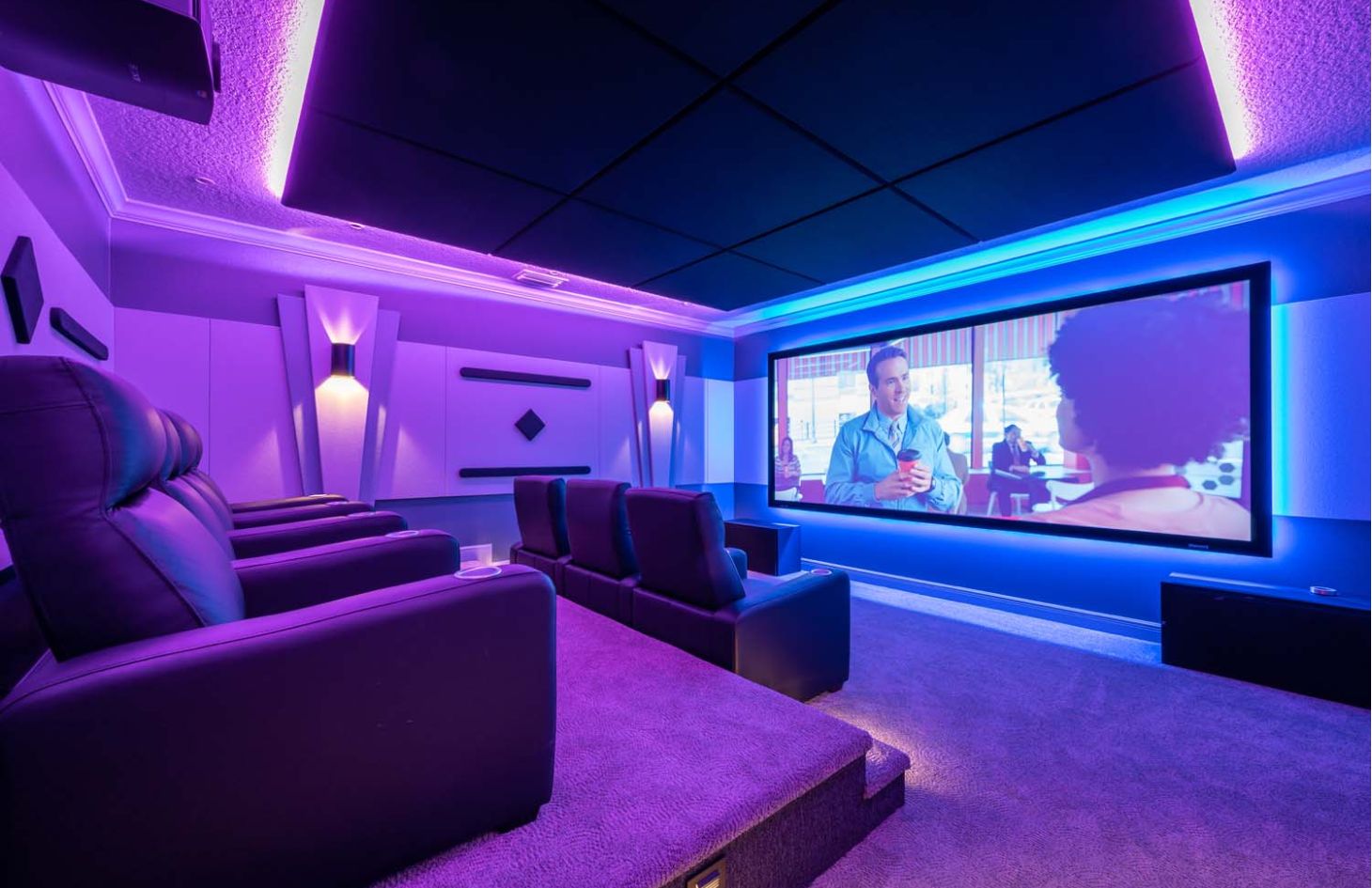 shot of patio outdoor with wooden accents and tv on wall