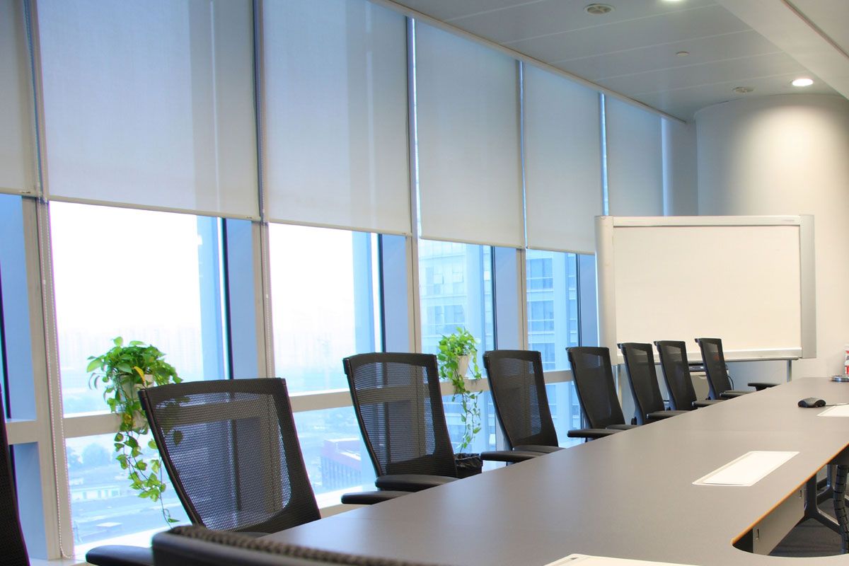 black chairs at a grey conference room table
