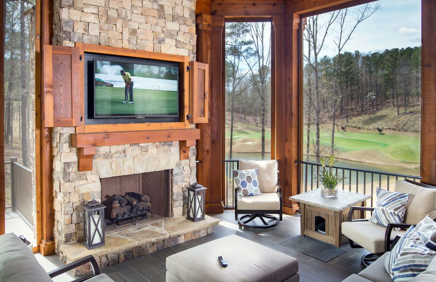 shot of patio outdoor with wooden accents and tv on wall